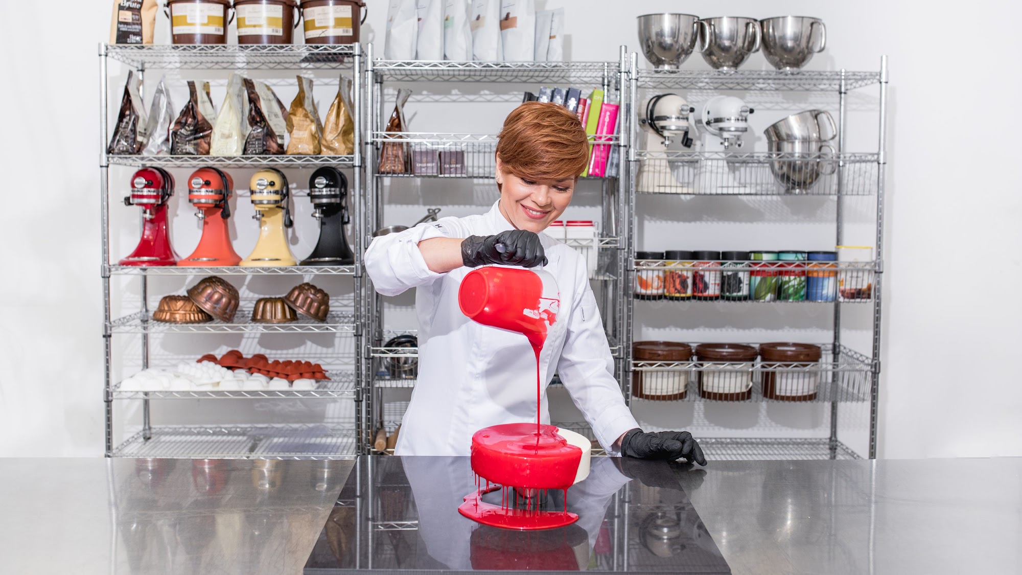 Tanya Novak glazing a cake in the pastry kitchen