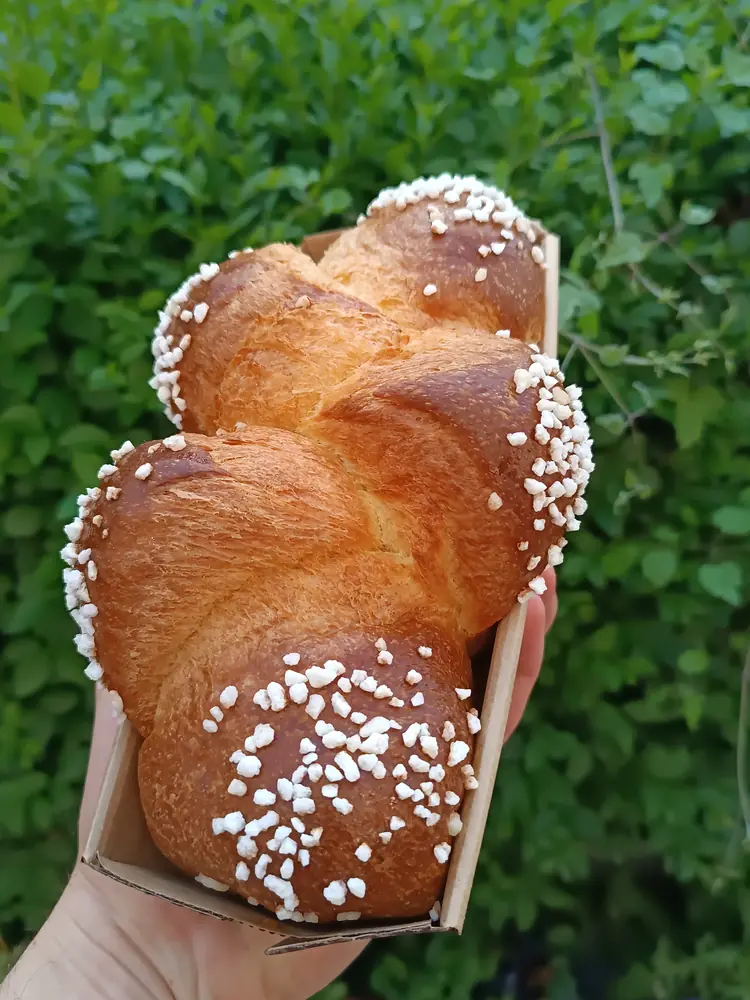 Glossy French brioche loaf with pearl sugar and a soft enriched butter-bread crumb