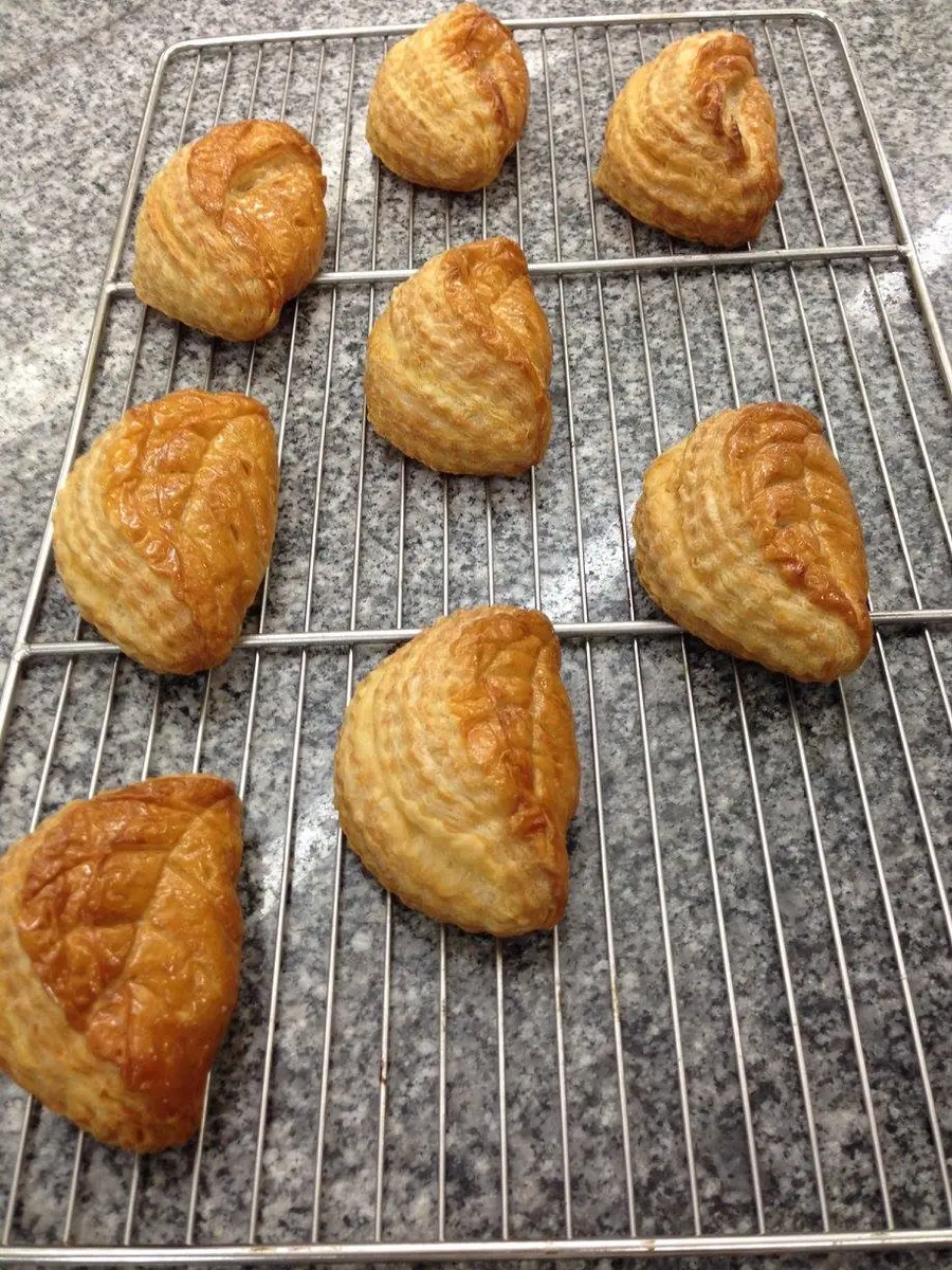 Small golden fruit turnovers with crisp layered pastry and sealed edges