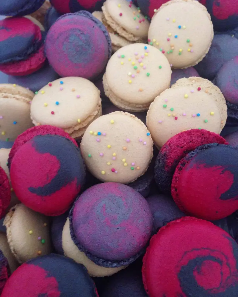 Assorted French macarons with smooth shells, defined feet and filled centres