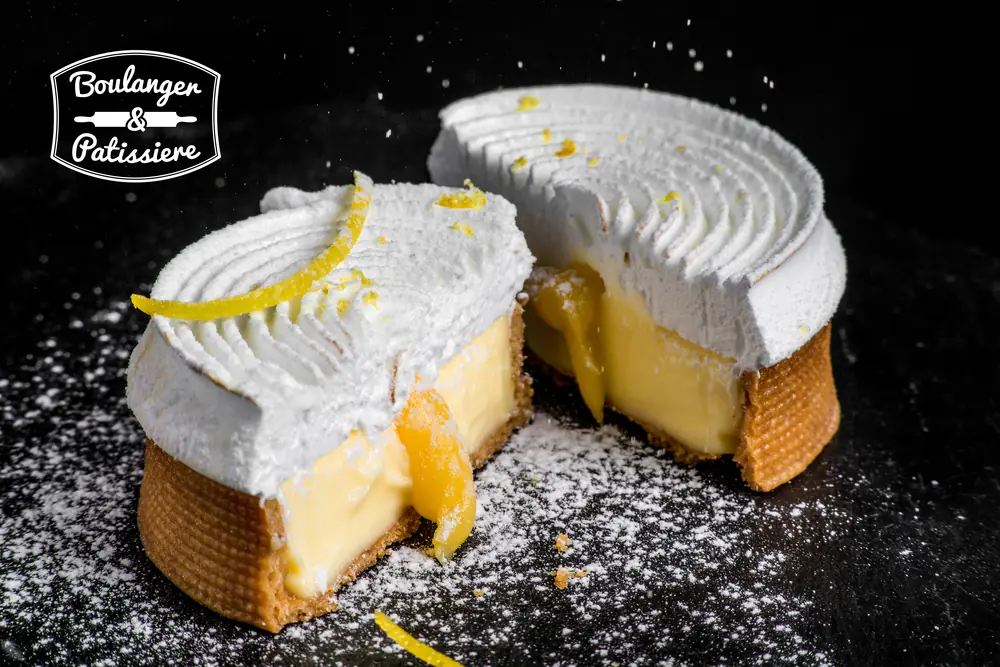 French lemon tart with crisp pastry shell, bright lemon filling and piped meringue