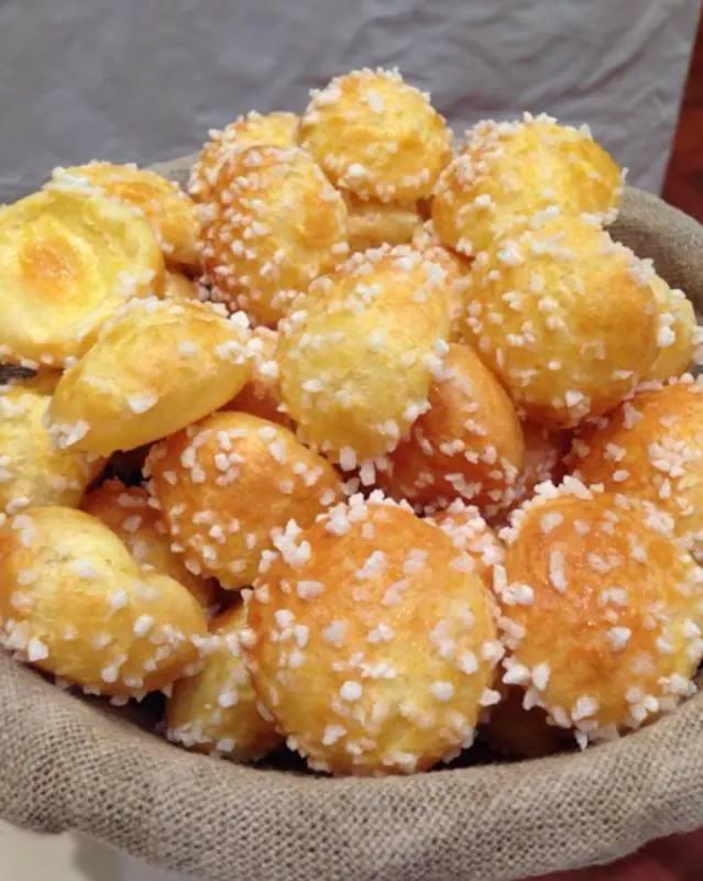 Golden French choux pastry puffs with pearl sugar and crisp expanded shells